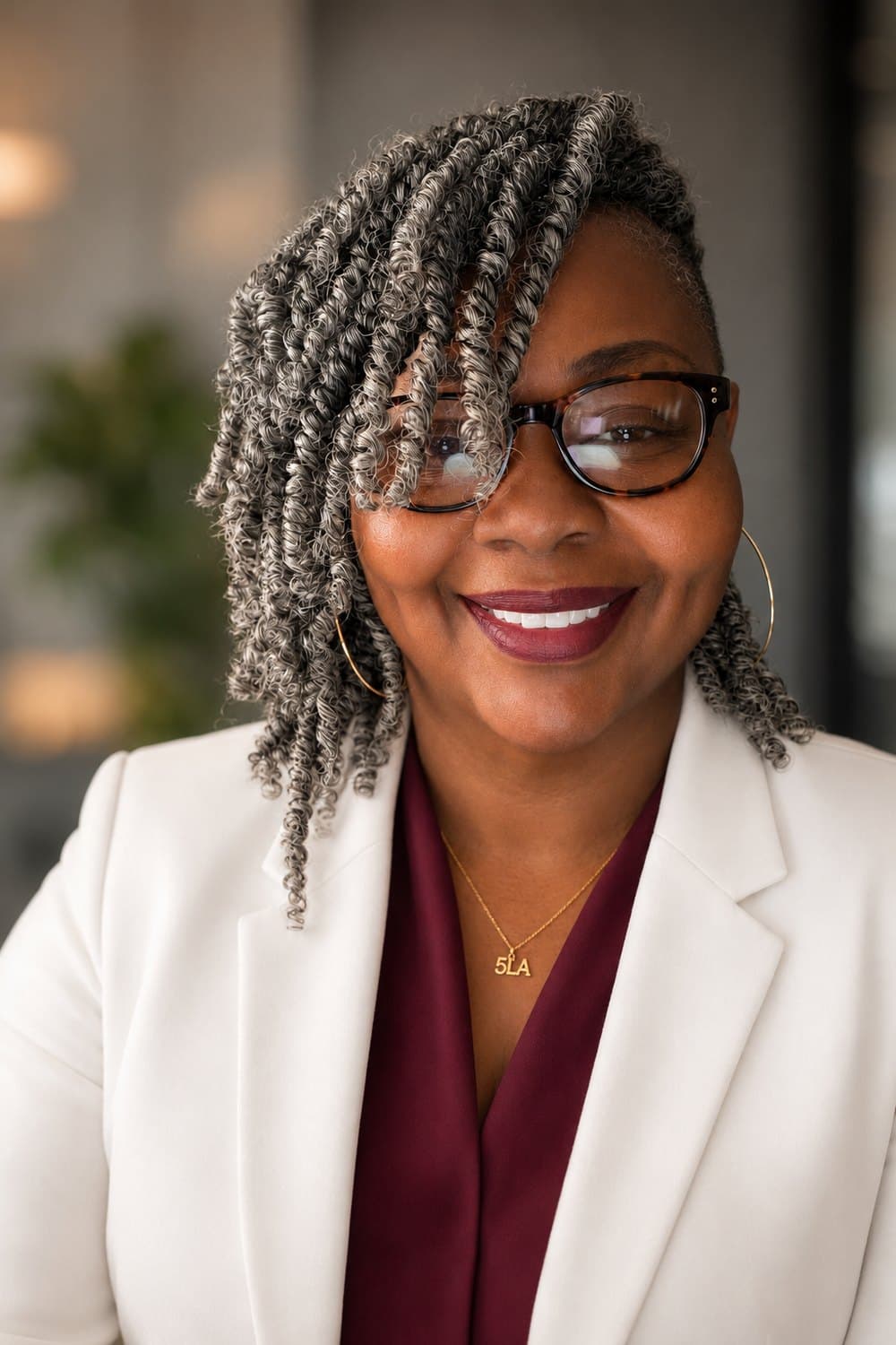 Corporate headshot of L.J., founder of The 5 Loaves Agency